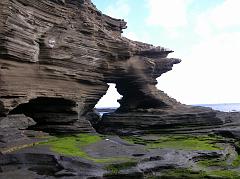 Galapagos 6-1-04 Santiago Puerto Egas Wavey Shoreline Named after the owner of a salt mine, Puerto Egas on the west side of Santiago begins with a wet landing on a long flat, black lava shoreline where eroded shapes form lava pools, caves and inlets. Here is a close up the beautiful wavey eroded shapes of the rocks on the shoreline at Puerto Egas.